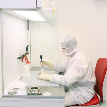 technician working in a clean room in laboratory technician working in a clean room
